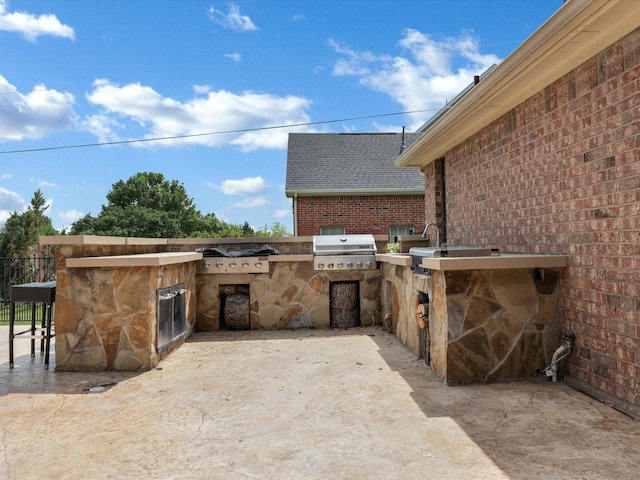 view of patio with exterior kitchen and area for grilling
