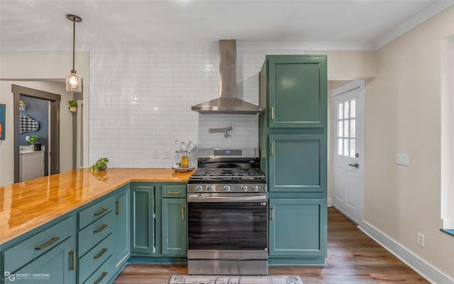 kitchen featuring stainless steel range with gas cooktop, wall chimney range hood, wooden counters, tasteful backsplash, and wood finished floors
