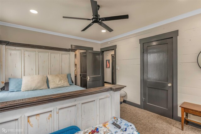 carpeted bedroom featuring crown molding, a ceiling fan, recessed lighting, and baseboards