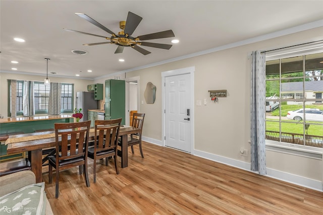 dining space with baseboards, ornamental molding, light wood-type flooring, recessed lighting, and a ceiling fan