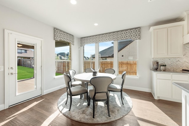 1009 Canuela Way, Justin, TX 76247 - dining space featuring a wealth of natural light, recessed lighting, dark wood-type flooring, and baseboards