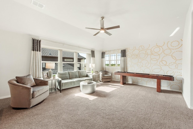 1009 Canuela Way, Justin, TX 76247 - carpeted living area with visible vents, a ceiling fan, wallpapered walls, and baseboards