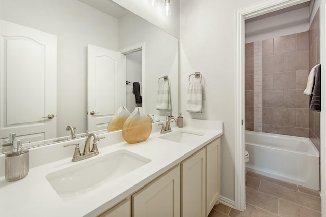 1009 Canuela Way, Justin, TX 76247 - full bathroom featuring toilet, tile patterned flooring, a sink, and double vanity