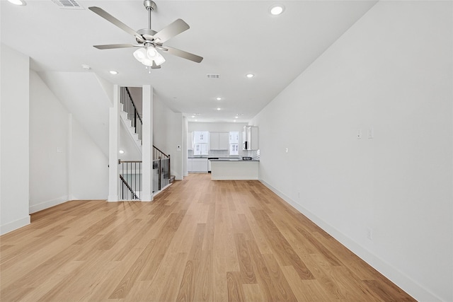 unfurnished living room with recessed lighting, light wood finished floors, and a ceiling fan
