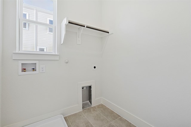 washroom featuring hookup for an electric dryer, hookup for a gas dryer, laundry area, hookup for a washing machine, and baseboards