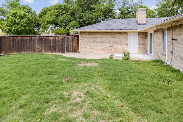 view of yard with a patio area and fence