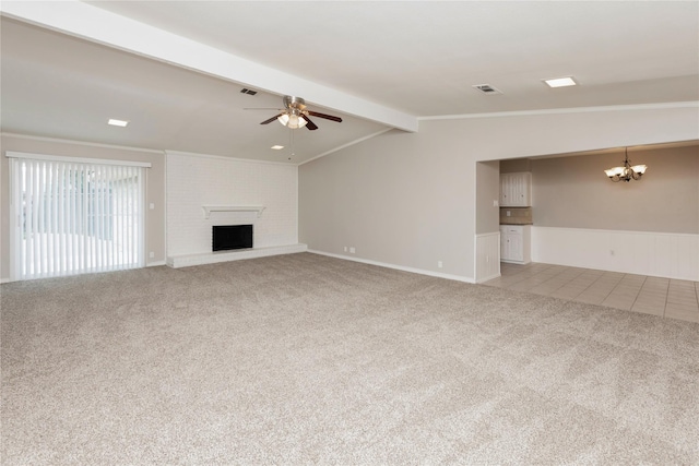 unfurnished living room featuring carpet flooring, a fireplace, vaulted ceiling with beams, visible vents, and ceiling fan with notable chandelier