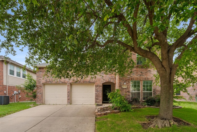 13140 Fencerow Rd, Fort Worth, TX 76244 - view of front of home featuring brick siding, a garage, driveway, and a front yard