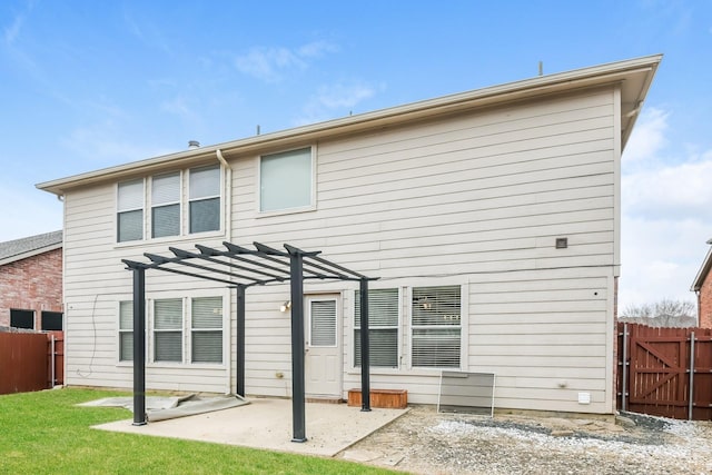 back of property featuring fence, a pergola, a yard, and a patio area