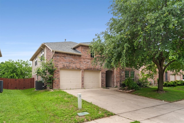 13140 Fencerow Rd, Fort Worth, TX 76244 - view of front of property featuring driveway, a front yard, brick siding, fence, and an attached garage