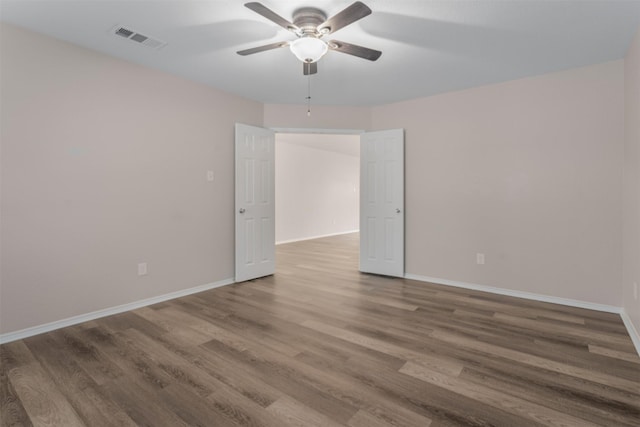 13140 Fencerow Rd, Fort Worth, TX 76244 - empty room with a ceiling fan, baseboards, visible vents, and wood finished floors