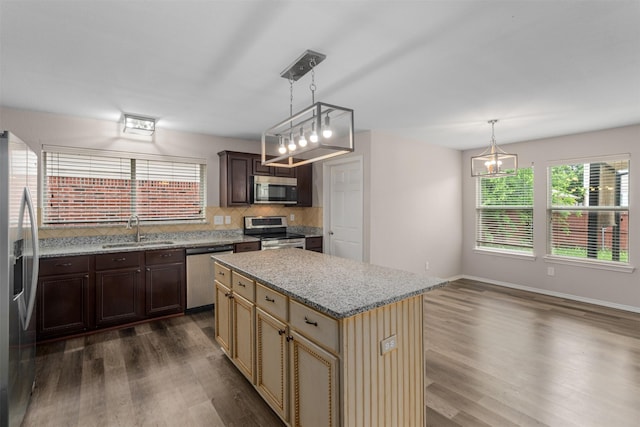 13140 Fencerow Rd, Fort Worth, TX 76244 - kitchen with plenty of natural light, a sink, appliances with stainless steel finishes, and dark wood-style floors