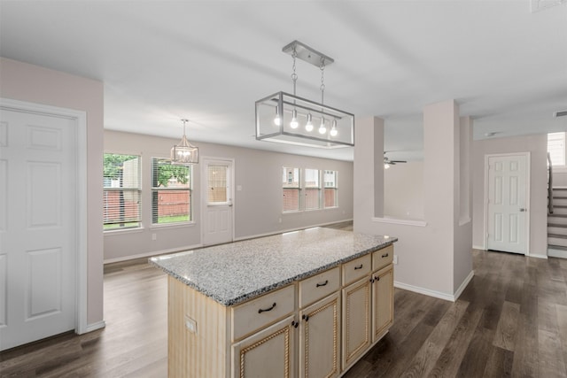 13140 Fencerow Rd, Fort Worth, TX 76244 - kitchen featuring pendant lighting, baseboards, open floor plan, dark wood-style floors, and cream cabinetry