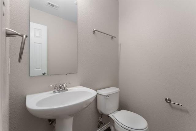 13140 Fencerow Rd, Fort Worth, TX 76244 - bathroom with toilet, visible vents, and a sink