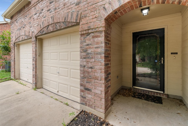 13140 Fencerow Rd, Fort Worth, TX 76244 - doorway to property with concrete driveway, brick siding, and a garage