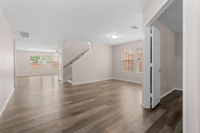 13140 Fencerow Rd, Fort Worth, TX 76244 - unfurnished living room with baseboards, visible vents, wood finished floors, and stairway