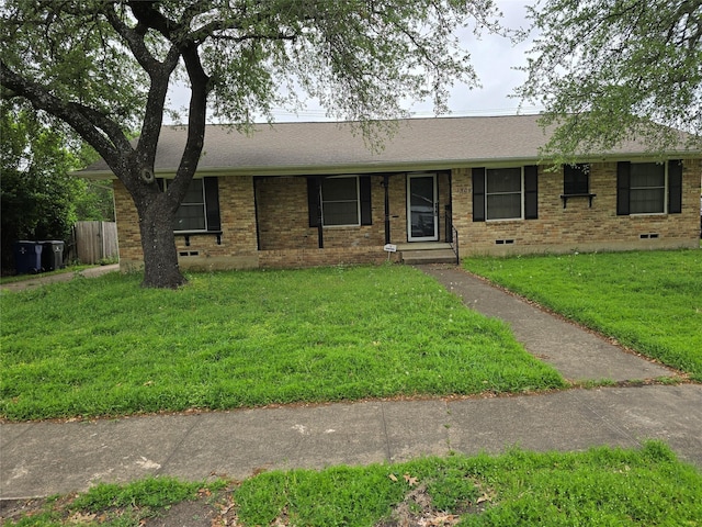 single story home with a front yard, crawl space, a shingled roof, and brick siding