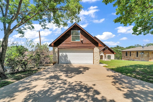 6107 Grande Cove Ct, Granbury, TX 76049 - chalet / cabin with driveway, a front yard, and stone siding