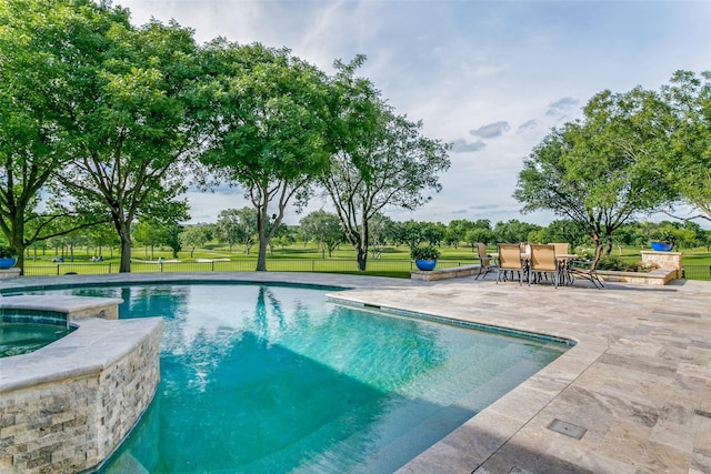 1505 Cottonwood Valley Cir N, Irving, TX 75038 - view of swimming pool featuring a patio, a pool with connected hot tub, a yard, and outdoor dining space