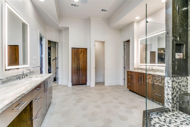 1505 Cottonwood Valley Cir N, Irving, TX 75038 - bathroom with two vanities, crown molding, tile patterned floors, recessed lighting, and a shower with shower door