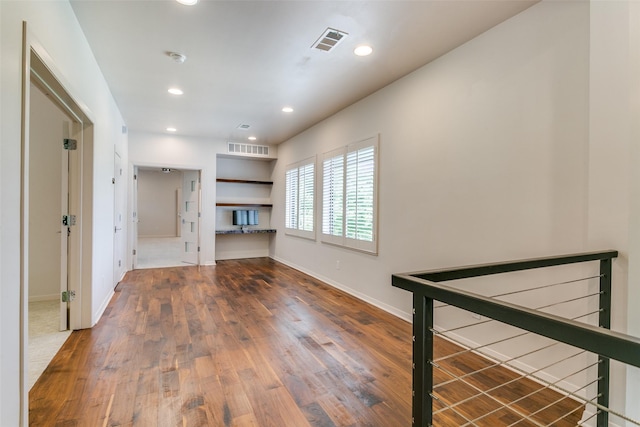 1505 Cottonwood Valley Cir N, Irving, TX 75038 - unfurnished living room featuring wood finished floors, baseboards, and recessed lighting