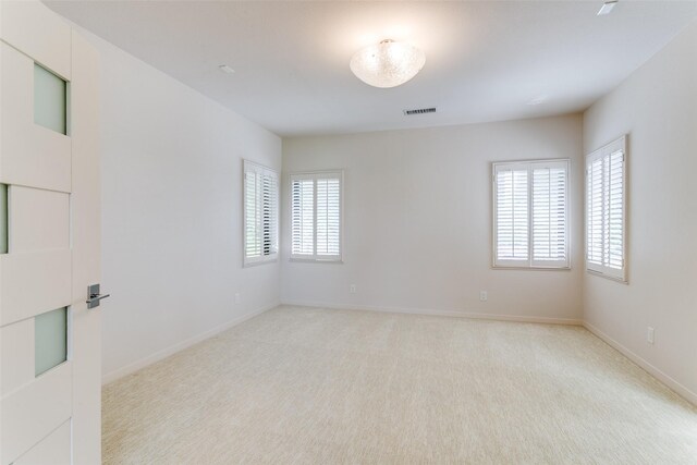 1505 Cottonwood Valley Cir N, Irving, TX 75038 - unfurnished room featuring light carpet and baseboards