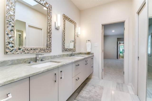 1505 Cottonwood Valley Cir N, Irving, TX 75038 - full bathroom with double vanity, baseboards, recessed lighting, and marble look tile flooring