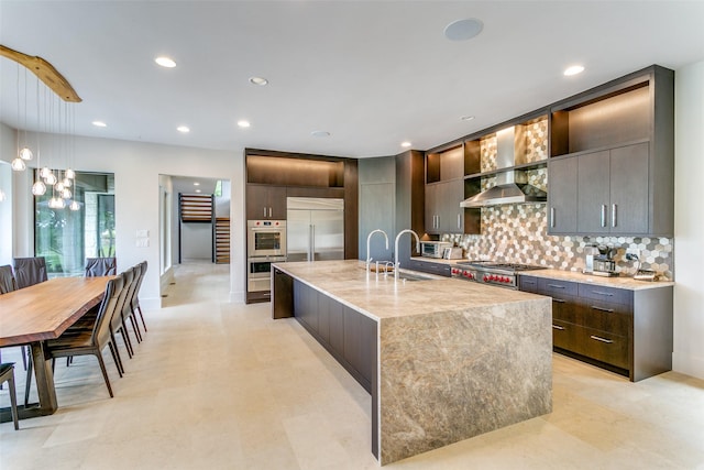 1505 Cottonwood Valley Cir N, Irving, TX 75038 - kitchen featuring stainless steel appliances, a sink, modern cabinets, tasteful backsplash, and an island with sink