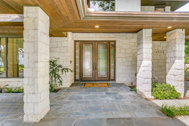 1505 Cottonwood Valley Cir N, Irving, TX 75038 - doorway to property featuring french doors and stone siding