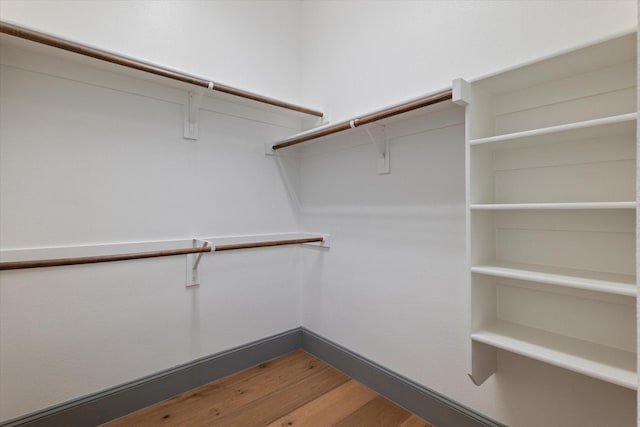 spacious closet with wood finished floors