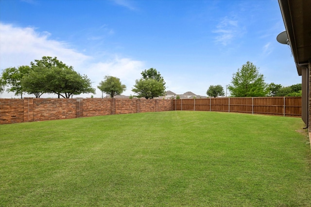 view of yard featuring a fenced backyard