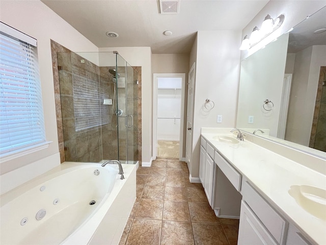 3617 Timothy Dr, Flower Mound, TX 75022 - bathroom featuring a tub with jets, double vanity, a sink, visible vents, and a stall shower
