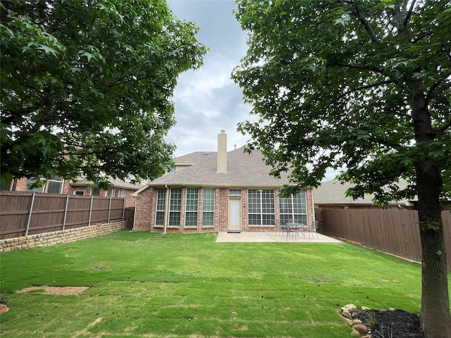 3617 Timothy Dr, Flower Mound, TX 75022 - rear view of property with a patio, a yard, a fenced backyard, and brick siding