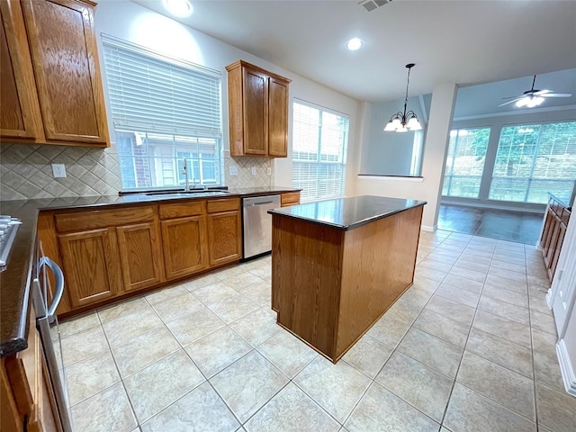 3617 Timothy Dr, Flower Mound, TX 75022 - kitchen featuring tasteful backsplash, brown cabinets, stainless steel dishwasher, a sink, and dark countertops