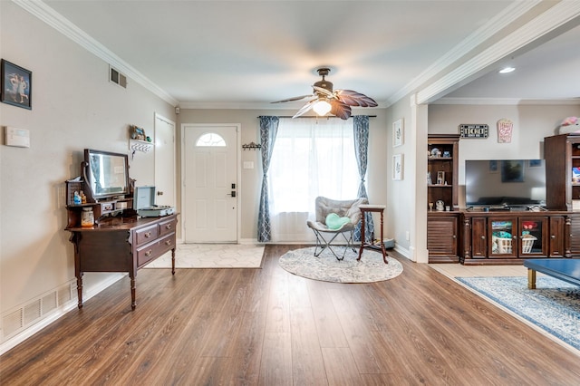 2914 Harvard St, Irving, TX 75062 - entryway featuring baseboards, a ceiling fan, wood finished floors, and visible vents