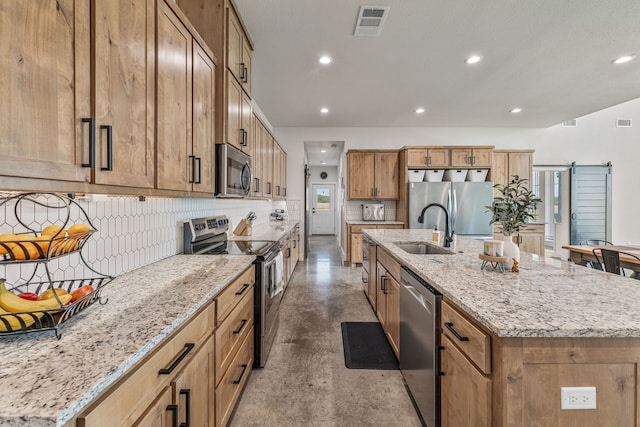 1400 Lacy Dr, Lipan, TX 76462 - kitchen with recessed lighting, appliances with stainless steel finishes, a sink, concrete flooring, and a center island with sink