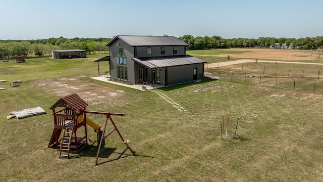 1400 Lacy Dr, Lipan, TX 76462 - back of house with fence, a rural view, a yard, and metal roof