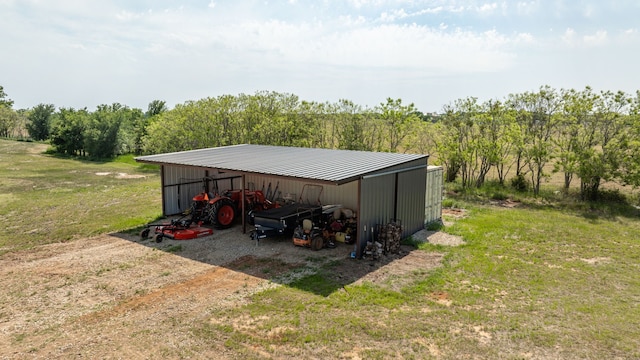 1400 Lacy Dr, Lipan, TX 76462 - view of pole building with a lawn and a detached carport