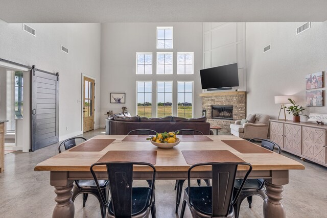 1400 Lacy Dr, Lipan, TX 76462 - dining space featuring a high ceiling, visible vents, and a fireplace