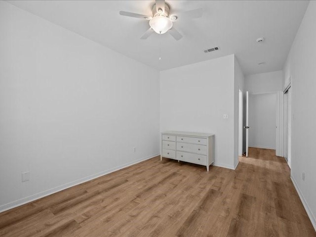 8313 Jonquil Dr, Waco, TX 76708 - unfurnished bedroom with baseboards, a ceiling fan, wood finished floors, and visible vents
