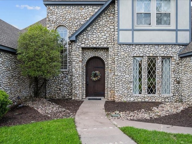 8313 Jonquil Dr, Waco, TX 76708 - doorway to property featuring stone siding and stucco siding
