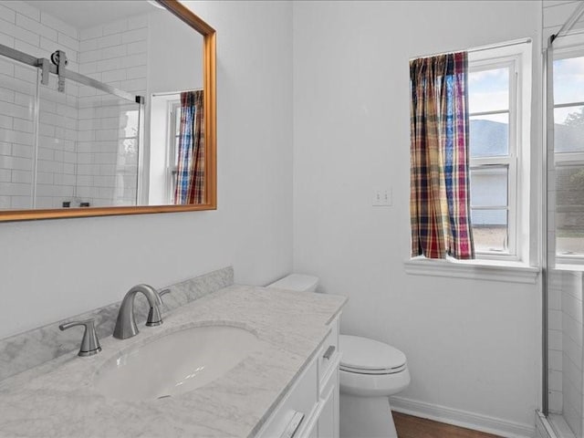 8313 Jonquil Dr, Waco, TX 76708 - bathroom with vanity, baseboards, toilet, and a shower stall
