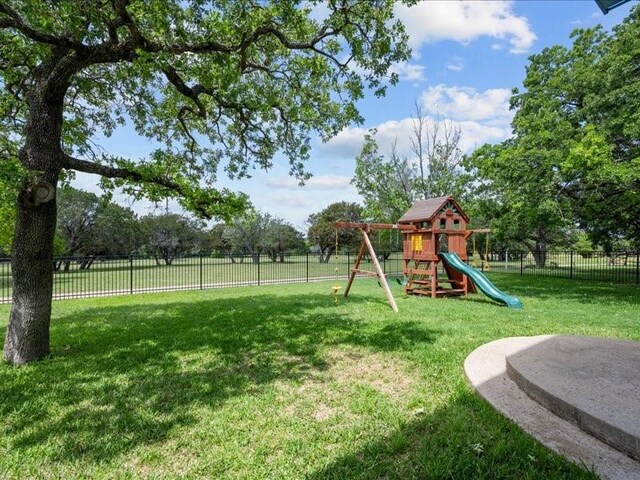 8313 Jonquil Dr, Waco, TX 76708 - view of jungle gym with a lawn and a fenced backyard