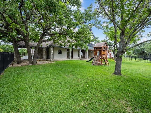 8313 Jonquil Dr, Waco, TX 76708 - view of yard featuring a fenced backyard and a playground