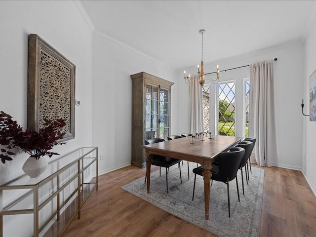 8313 Jonquil Dr, Waco, TX 76708 - dining space with baseboards, ornamental molding, wood finished floors, and a notable chandelier