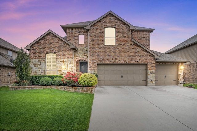 641 Mangrove Trl, Saginaw, TX 76131 - french country home with brick siding, a yard, driveway, and stone siding