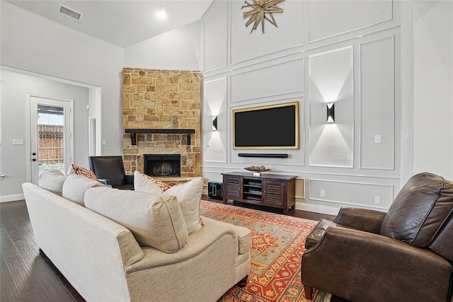 641 Mangrove Trl, Saginaw, TX 76131 - living room with dark wood-style flooring, visible vents, a fireplace, vaulted ceiling, and baseboards