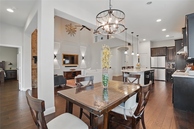 641 Mangrove Trl, Saginaw, TX 76131 - dining space with dark wood-style flooring, a high ceiling, a chandelier, recessed lighting, and baseboards