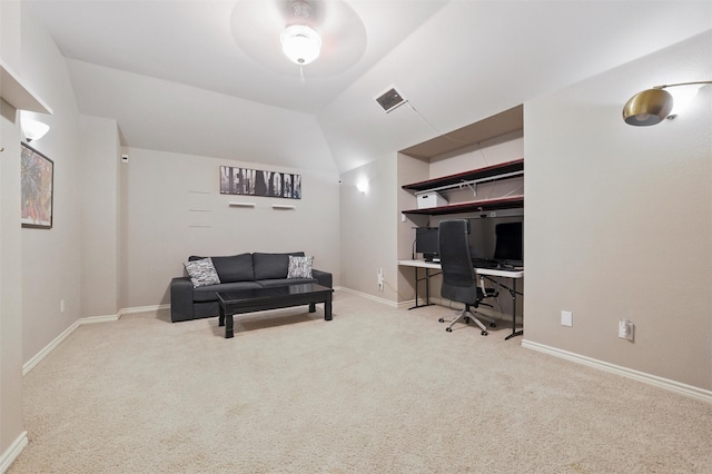 carpeted home office featuring baseboards, a ceiling fan, and visible vents