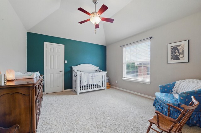 carpeted bedroom featuring baseboards, a ceiling fan, and lofted ceiling
